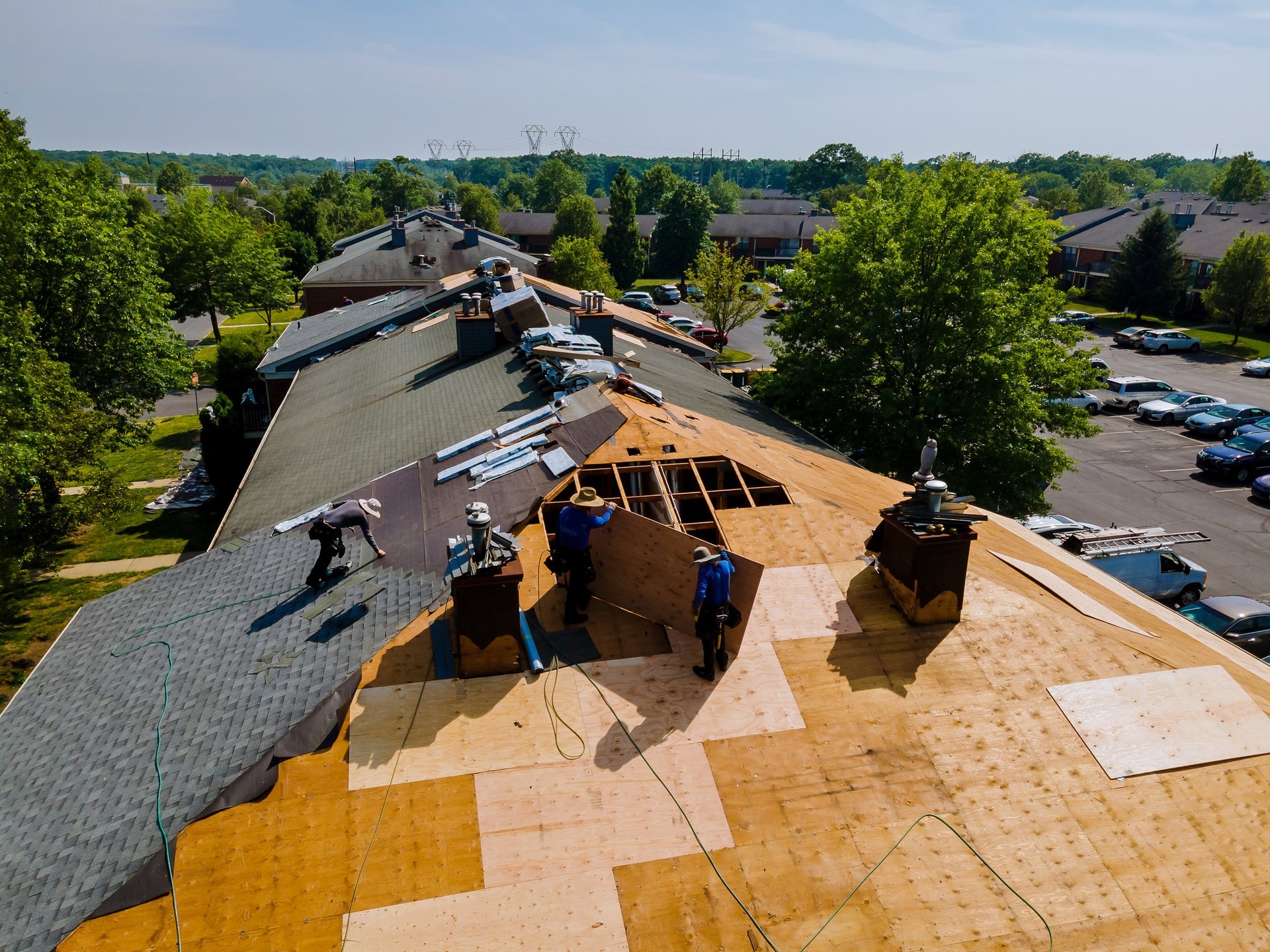 Roofing project with workers on residential roof