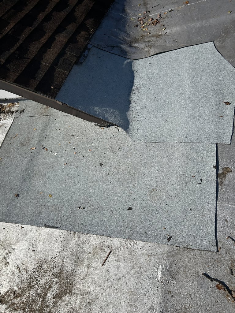 Overhead view of concrete surfaces with shadow from metal structure and scattered debris